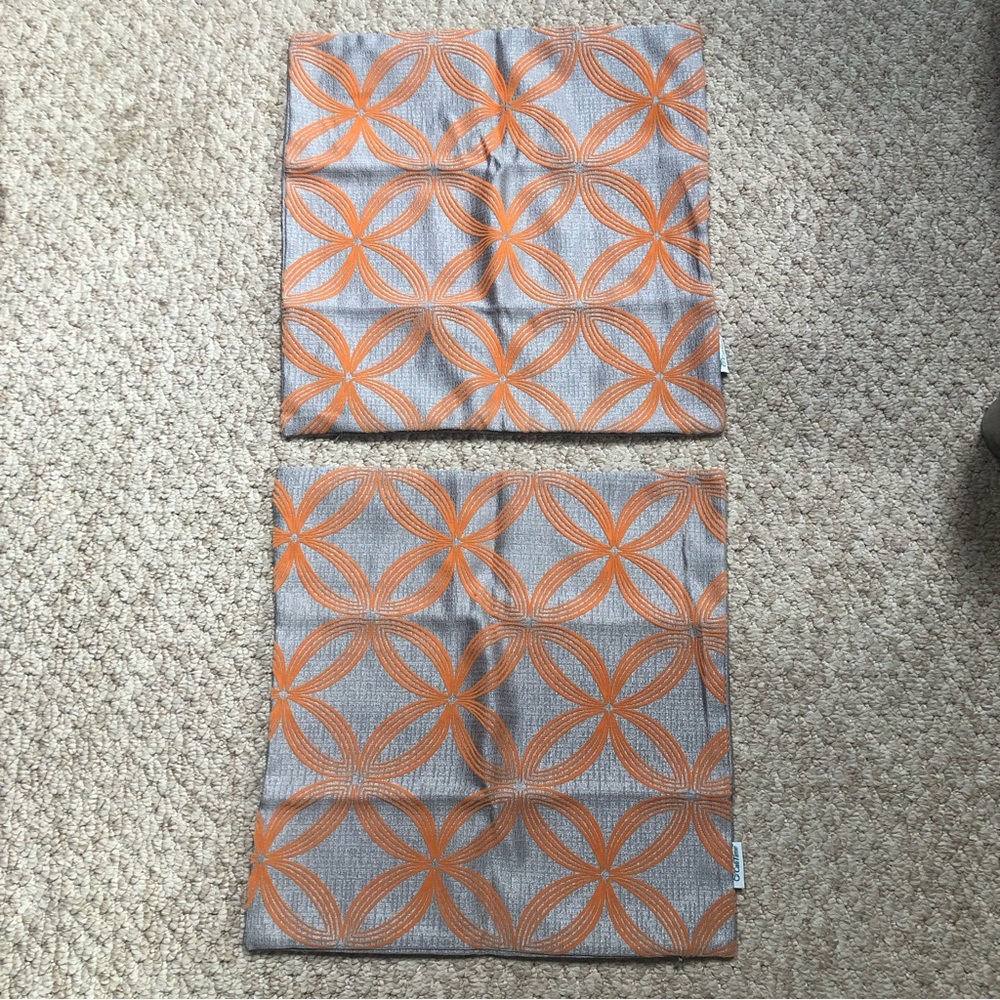 New in package zippered throw pillow covers x2. Grey/orange. 17.5 x 17.5”